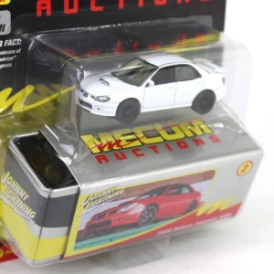 Manufacturer_Johnny Lightning Cars & Suvs<1/64 2006 Subaru Impreza WRX, White with Black Rims, Mecum Auctions, Johnny Lightning Collector Tin Series 15