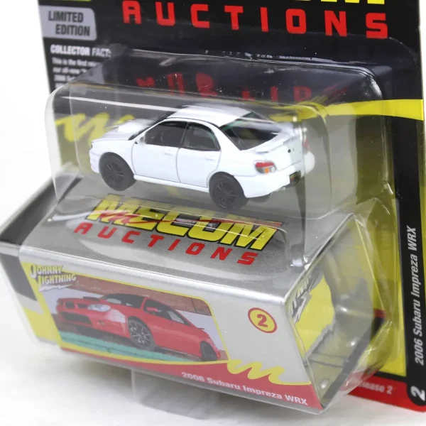 Manufacturer_Johnny Lightning Cars & Suvs<1/64 2006 Subaru Impreza WRX, White with Black Rims, Mecum Auctions, Johnny Lightning Collector Tin Series 15